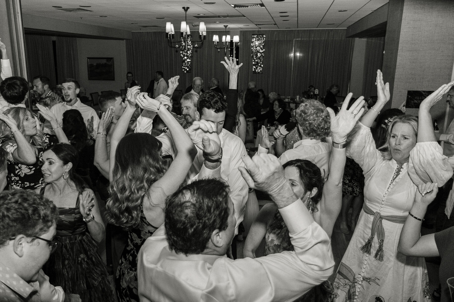 Wedding crowd with hands in the air